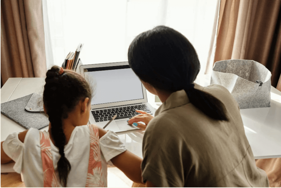 Kids with mother learning to code