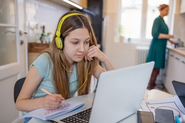 A kid coding on a laptop